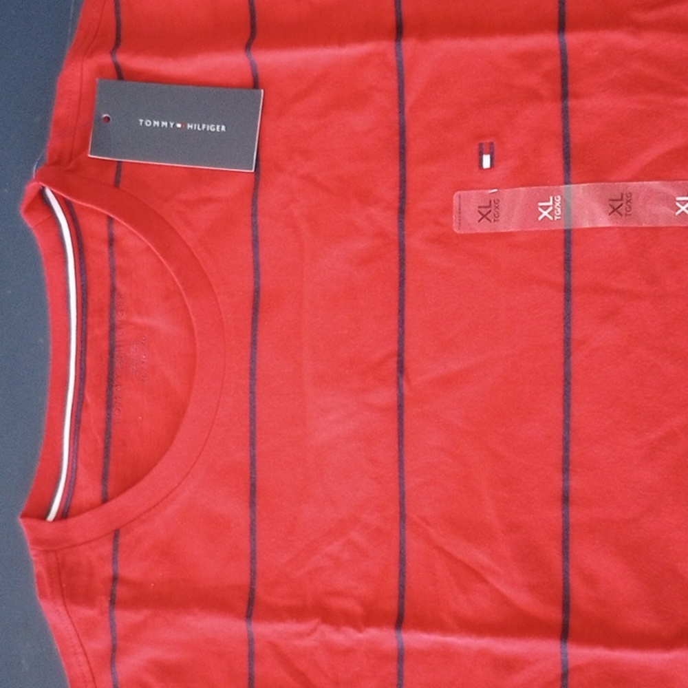 Tommy Hilfiger• Red with black stripes.